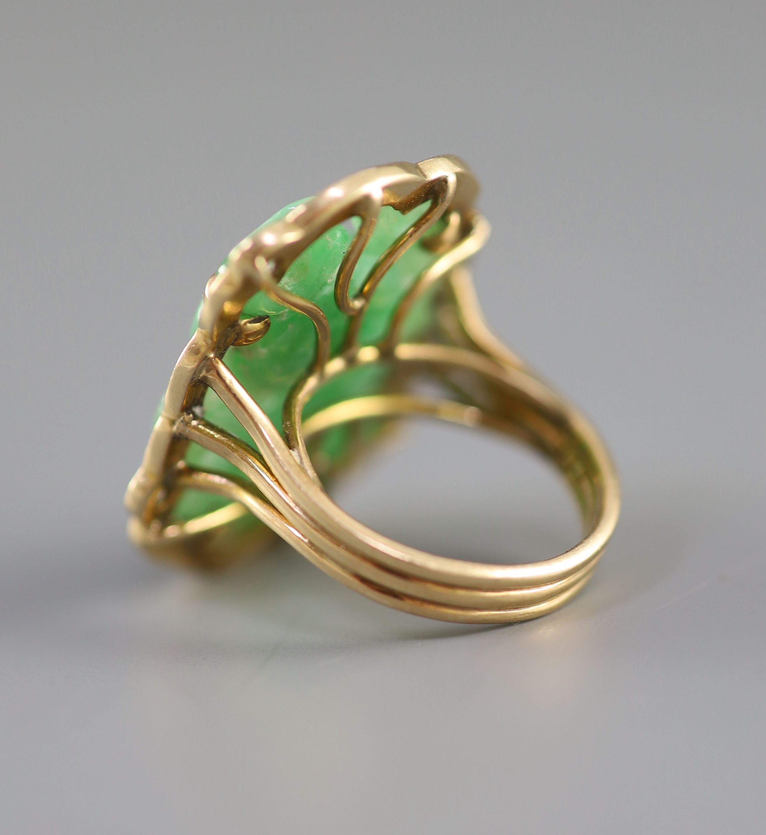 Two Chinese jadeite and gilt metal clips, first half 20th century and a yellow metal jadeite ‘fish’ ring, late 20th century, Clips 4.5 and 5cm